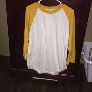 Long sleeve yellow and white shirt.